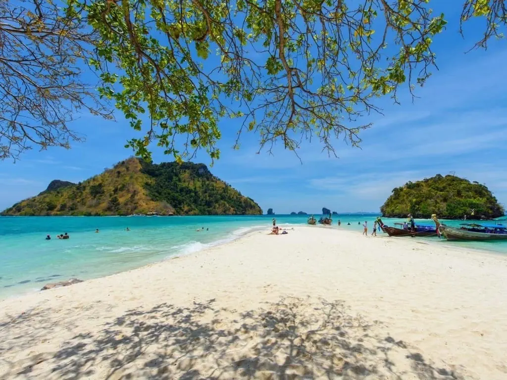 Krabi: Phi Phi Early Bird Tour with Multilingual Guide — longtail boat and island scenery near Ko Phi Phi Leh (photo 3)